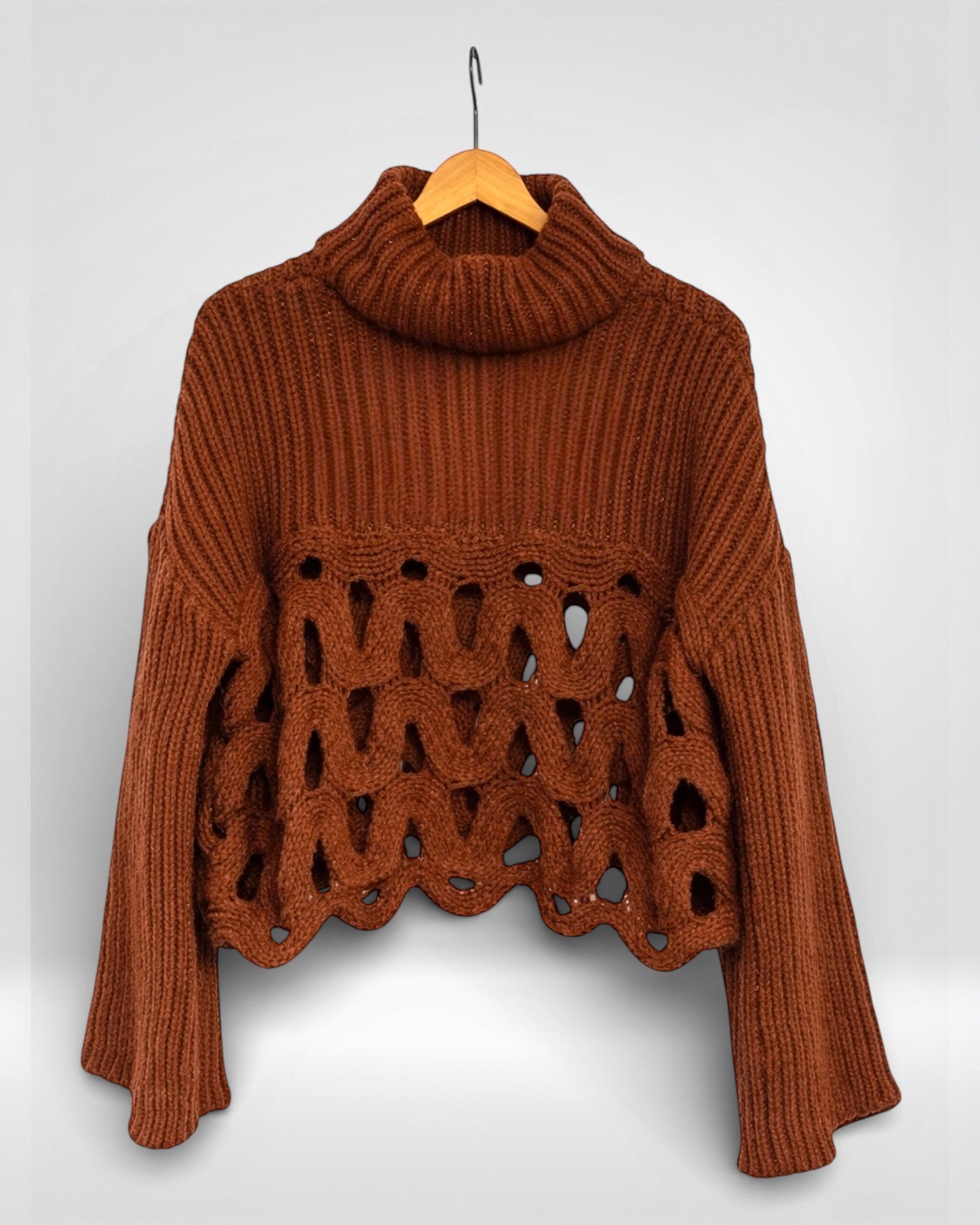 Pull en maille ondulée à col roulé côtelé ajouré